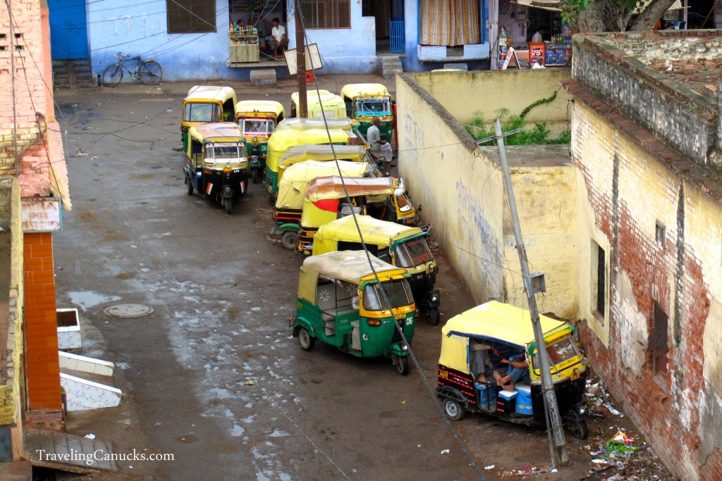 group of Tuk tuks in India, parked on the side streets