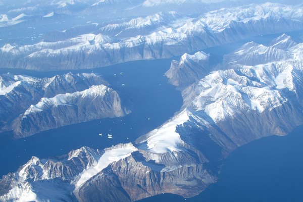 aerial photos of Greenland mountains and glaciers from airplane window seat
