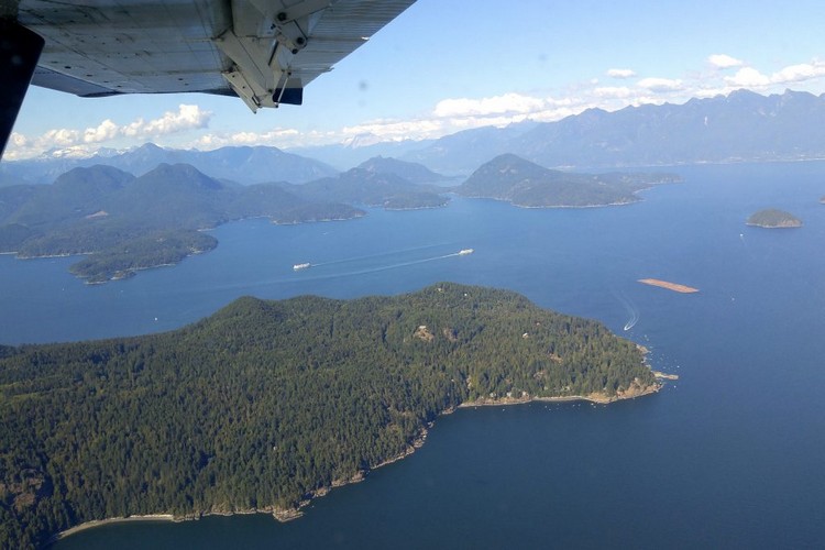 view of Bowen Island and Howe Sound from a float plane flying from Vancouver to Victoria, British Columbia