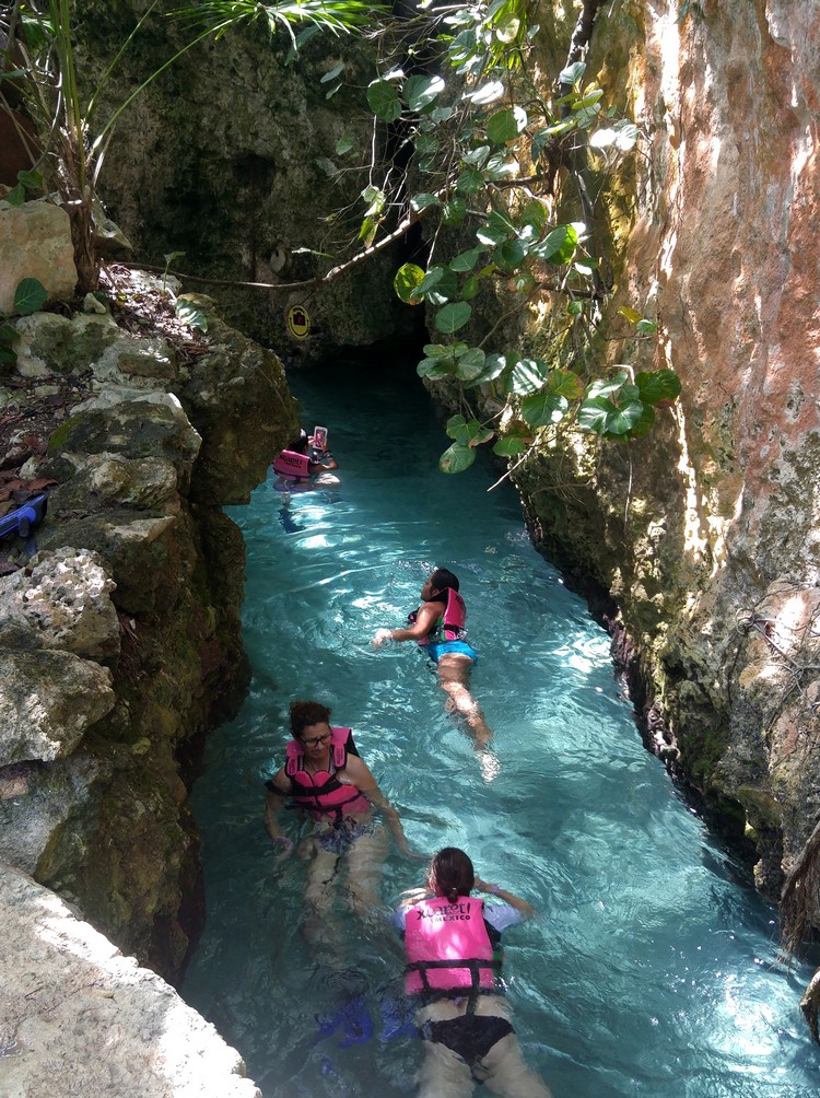 swimming in the floating underground river Xcaret, swimming in cave Xcaret, Cancun Mexico travel guide