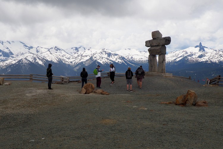 the iconic Inuksuk at Top of the World Summit on the peak of Whistler Mountain