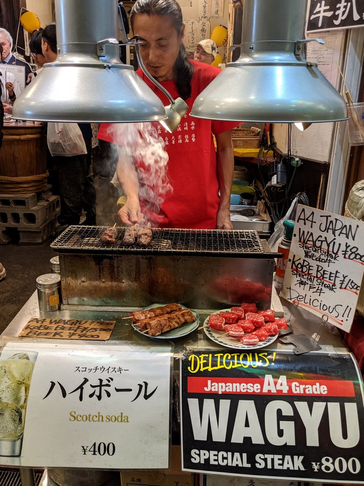 Grilled wagyu beef on a skewer at Nishiki Market in Kyoto Japan