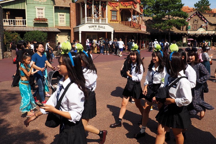 Japanese girls dressed in similar Disney themed costumes at Tokyo Disney Resort