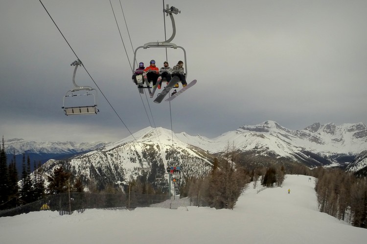 winter mountain views of larch on lake louise ski resort in banff alberta