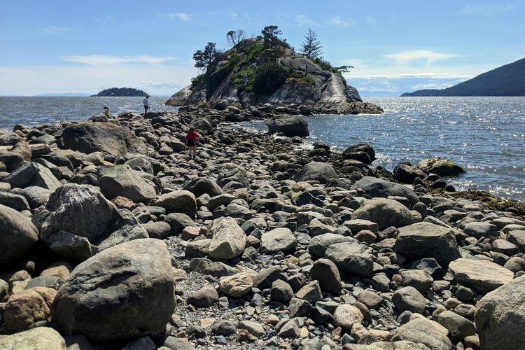 Low tide reveals the rocky path to Whyte Islet from Whytecliff Beach Park in West Vancouver