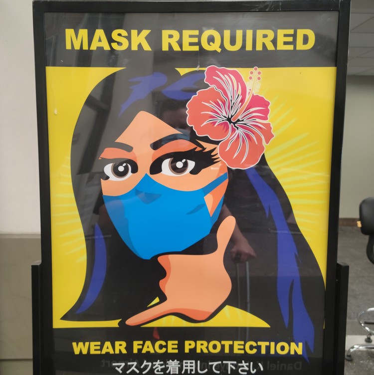 mask required sign at Honolulu Airport in Oahu Hawaii, travel requirements to Hawaii right now