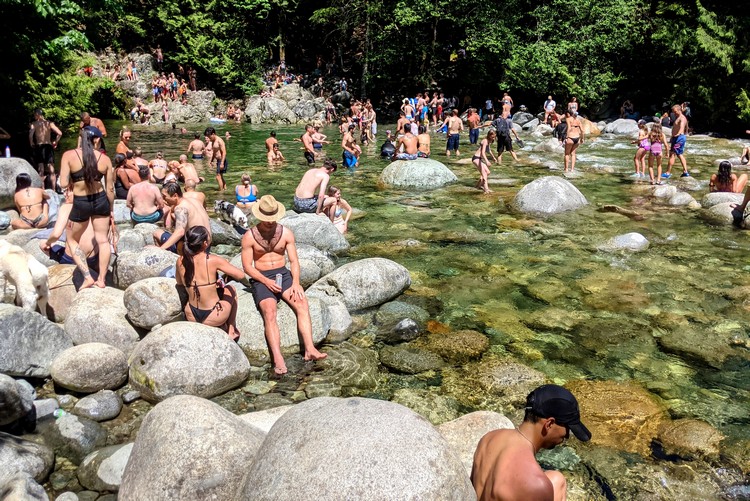 busy crowds at 30 foot pool in Lynn Canyon Park, North Vancouver