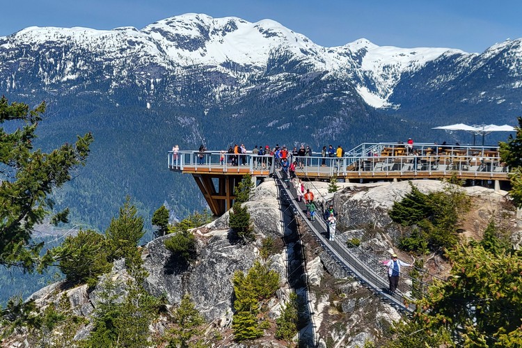Summit Lodge viewing platform with snow capped mountains in the distance, Sea to Sky Gondola hiking trails, things to do in Squamish this summer
