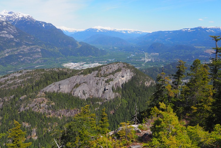 Top of the Stawamus Chief with views of Squamish in the distance