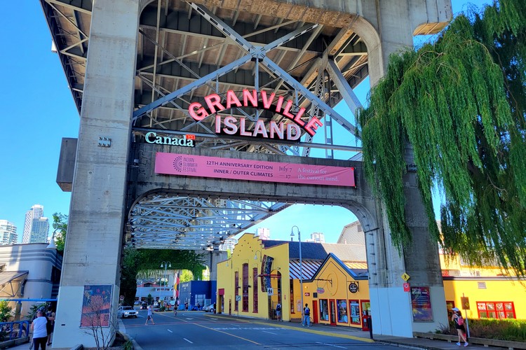 neon granville island sign at entrance to granville island in Vancouver