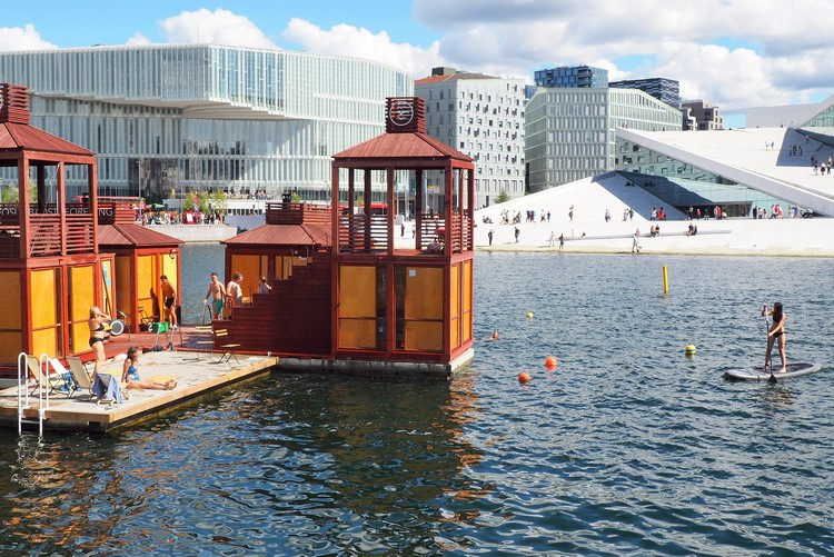 Floating saunas in front of the iconic Oslo Opera House