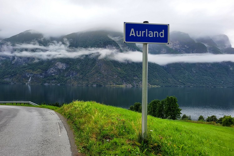 sign that says Aurland, located in Aurlandsfjord, Norway road trip