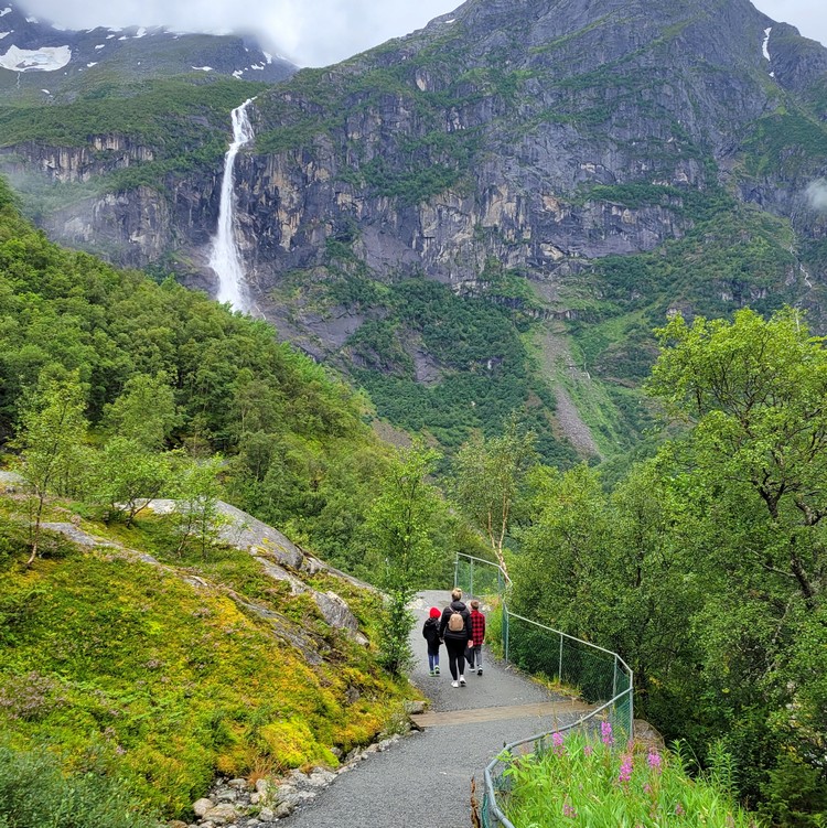 Hiking trial at Briksdalsbreen in Jostedalsbreen National Park surrounding by mountains and waterfalls