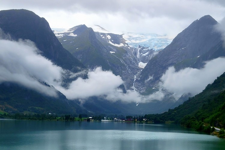 First view of Jostedalsbreen Glacier towering over Oldevatnet lake Norway national park