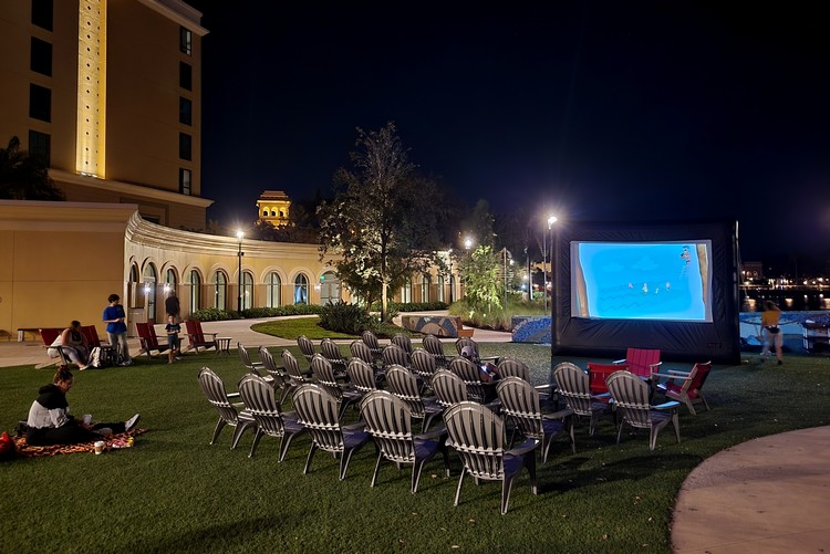 Movie night under the stars on the outdoor lawn in front of Gran Destino Tower, Disney Coronado Springs Resort