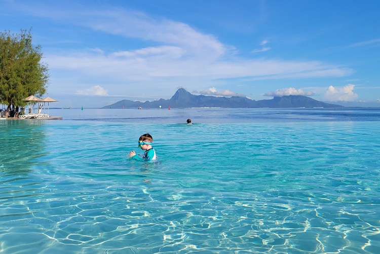 infinity pool at Te Moana Tahiti Resort with clear view of Moorea island in the distance