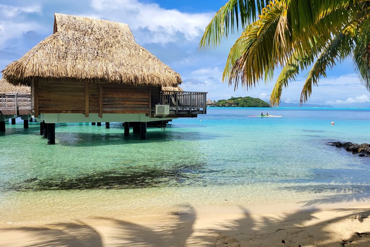 overwater bungalow on Bora Bora mainland, not lagoon. Beautiful beach with clear blue water that is very calm
