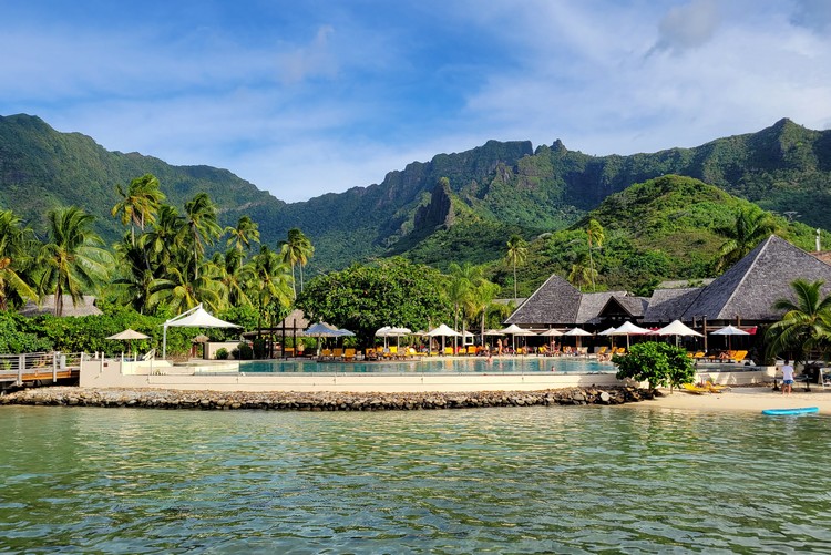 Manava Beach Resort Moorea landscape, green lush volcano mountains with infinity pool and beach 