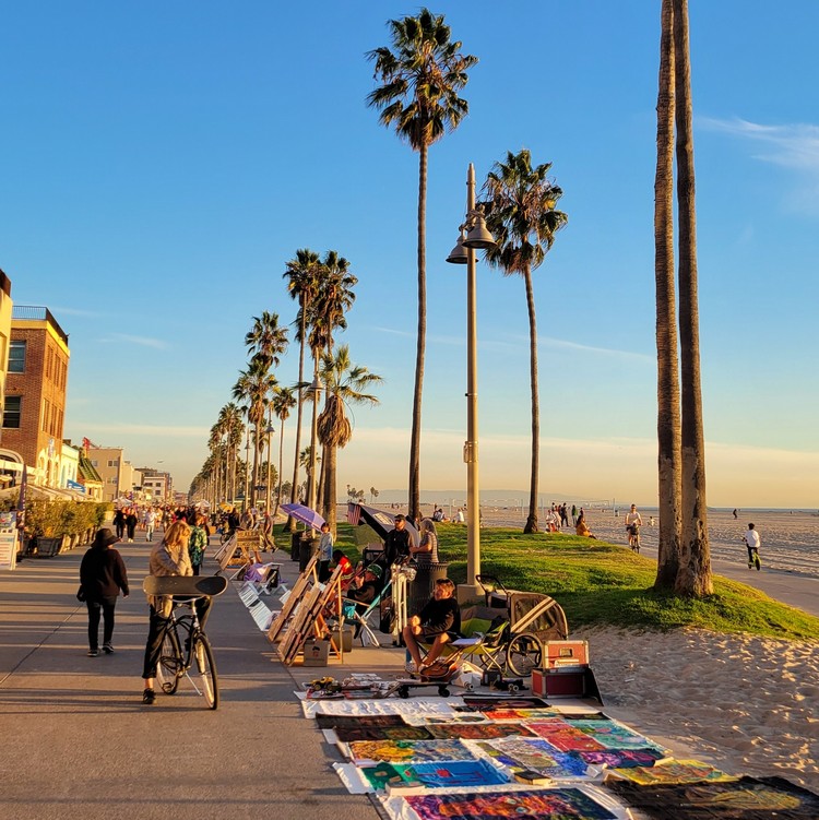 Artists and street vendors on the Venice Beach Boardwalk weekend in Los Angeles California
