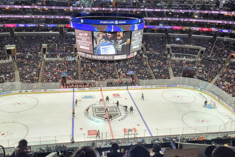 inside Cryptocom arena watching LA Kings hockey game from upper level at center ice